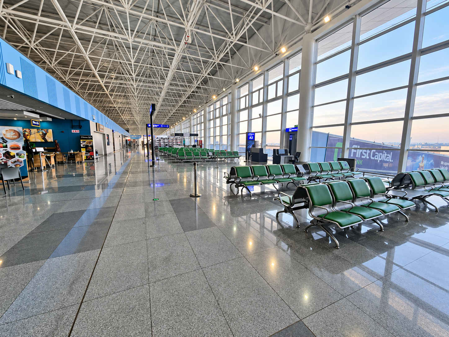 Interior of Kenneth Kaunda International Airport in Lusaka, Zambia, showing the passenger terminal and architectural glazing