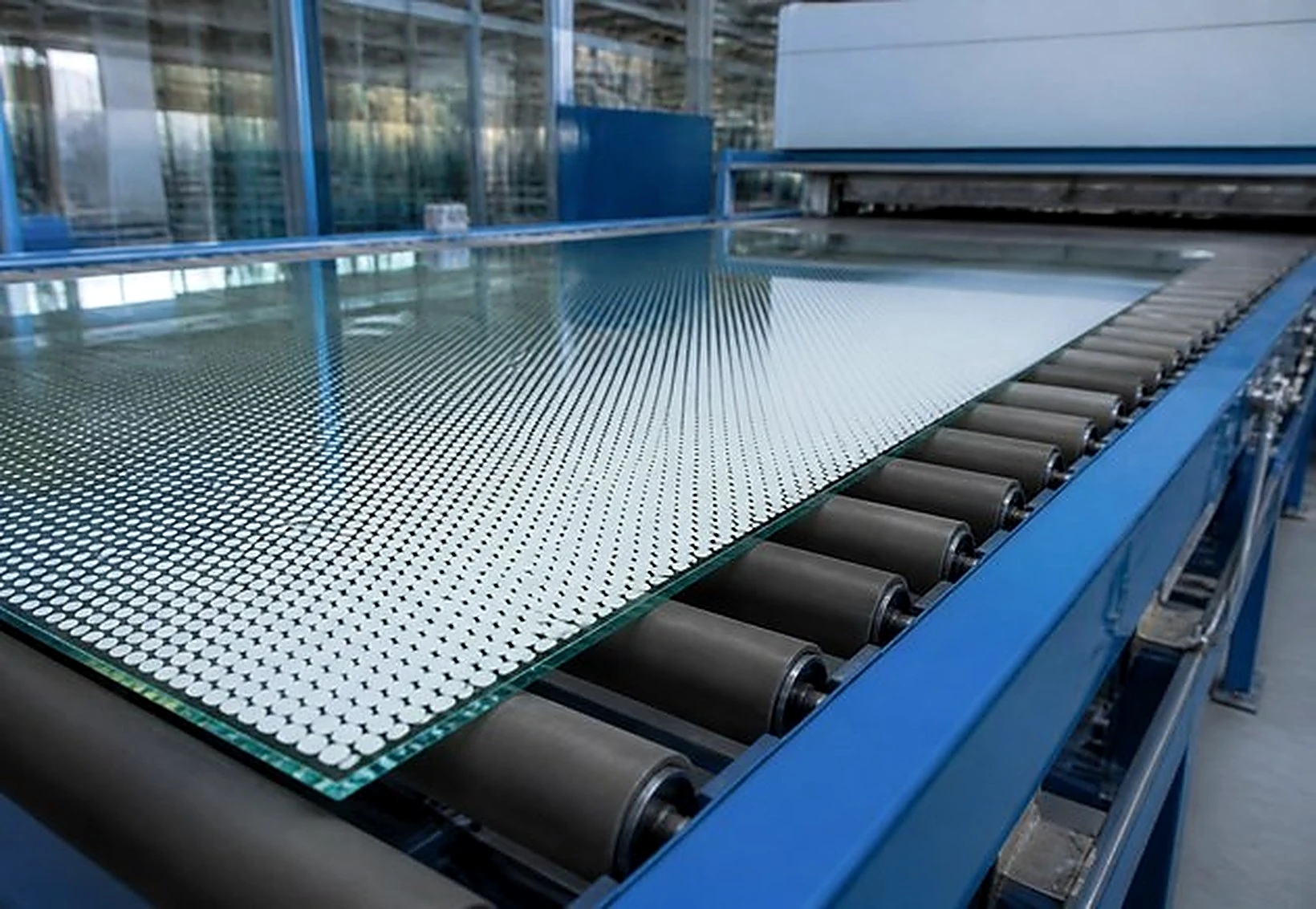Ceramic frit applied to glass through a mesh screen before tempering