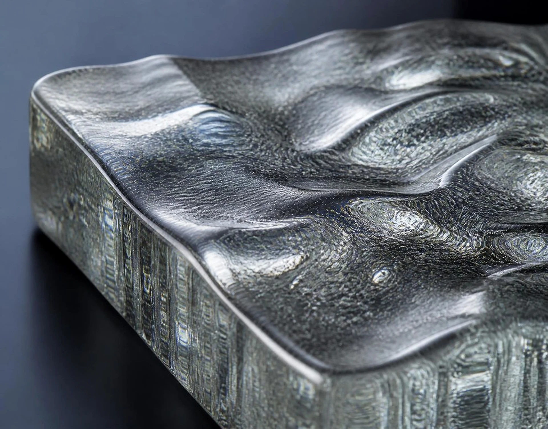 Cast glass slab in 40 mm section showing three-dimensional relief